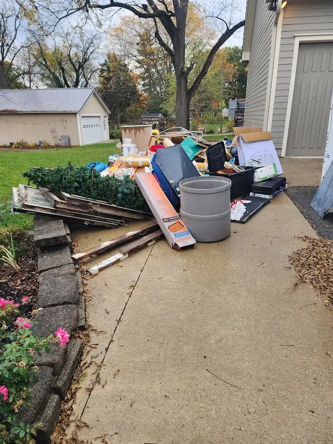 Dumpster being loaded with debris for Commercial Dumpster Rental in Pasadena